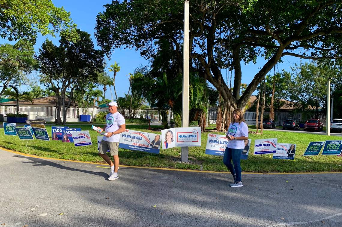 Martin and Sofia Perez greet voters at the Snapper Creek precinct on Sunset Drive in the Kendall area. Their daughter is Janelle Perez, a candidate for State Senate in District 38.