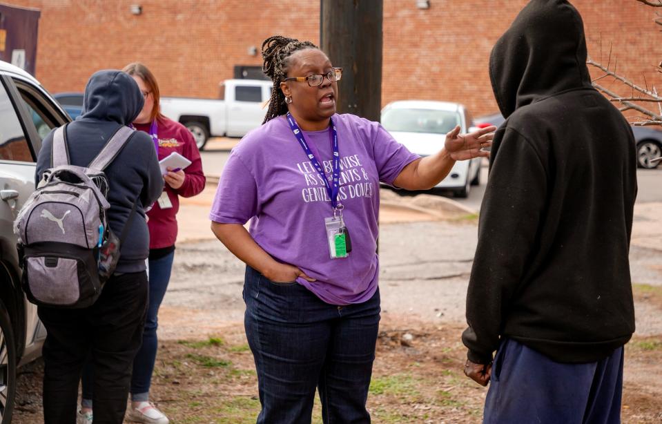 Street outreach and case manager Stephanie Newman speaks with a homeless client during a Mental Health Association of Oklahoma homeless outreach stop in Oklahoma City, Okla. on Monday, March 6, 2023.