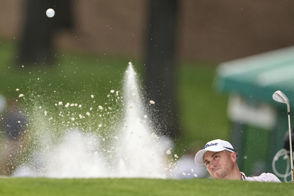 Justin Thomas hits from a bunker on the 12th hole during final round of the Wells Fargo Championship golf tournament at the Quail Hollow Club on Sunday, May 7, 2023, in Charlotte, N.C. (AP Photo/Chris Carlson)