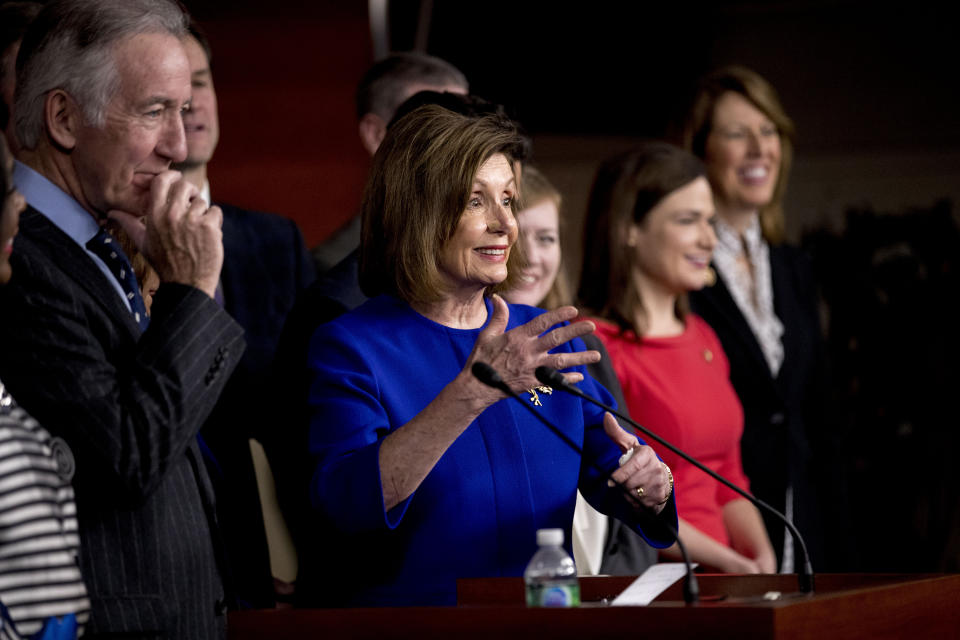 House Speaker Nancy Pelosi of Calif., accompanied by Chairman of the House Ways and Means Committee Richard Neal, D-Mass., left, speaks at a news conference to discuss the United States Mexico Canada Agreement (USMCA) trade agreement, Tuesday, Dec. 10, 2019, on Capitol Hill in Washington. (AP Photo/Andrew Harnik)