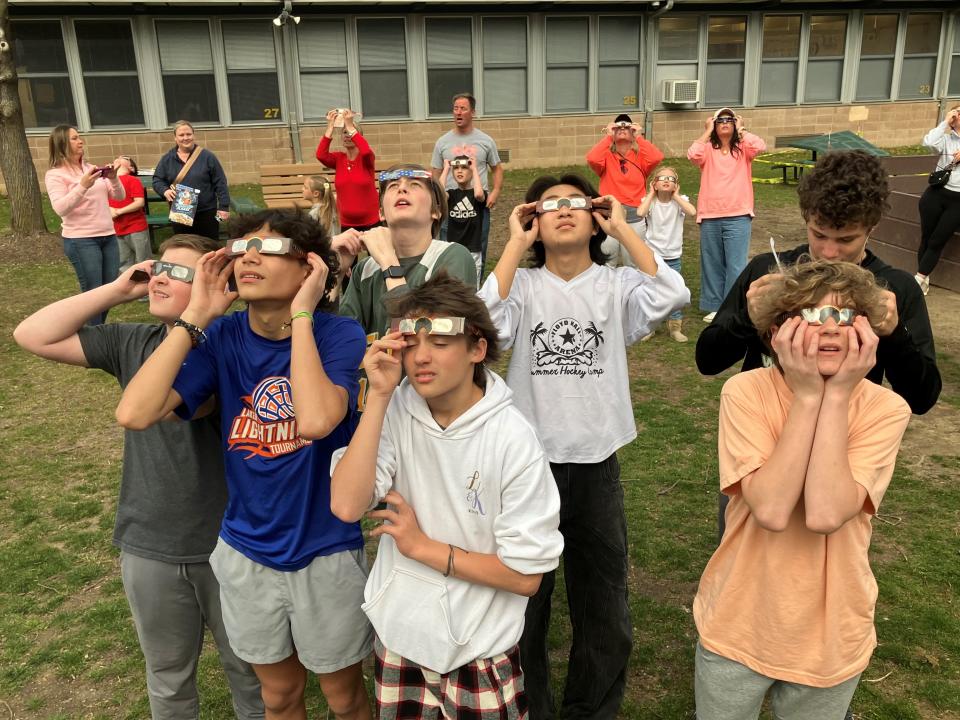 Students observe the eclipse during a viewing party at Rockaway Valley School in Boonton Township.