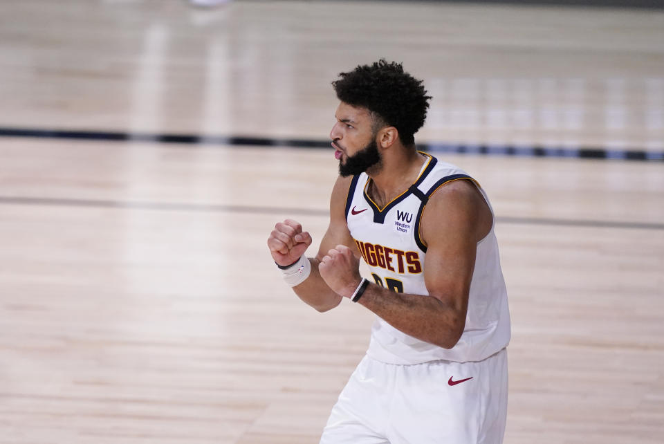 Denver Nuggets' Jamal Murray (27) celebrates during the second half of an NBA conference final playoff basketball game against the Los Angeles Lakers Sunday, Sept. 20, 2020, in Lake Buena Vista, Fla. (AP Photo/Mark J. Terrill)