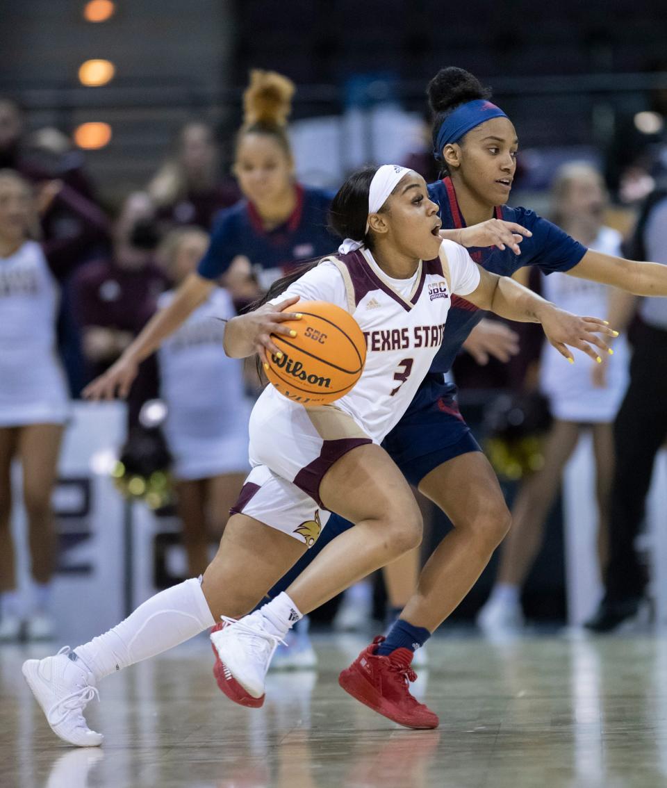 Texas State's Kennedy Taylor drives toward the basket during a 2022 Sun Belt Tournament game against South Alabama. One year later, Taylor and the Bobcats are headed to the Women's NIT after a runner-up finish in the conference tournament.