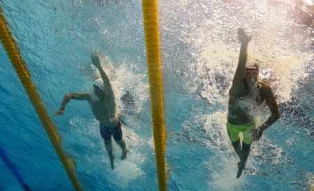 Gregorio Paltrinieri of Italy and Sun Yang (L) of China compete in the men's 1500m freestyle heats at the Aquatics World Championships in Kazan, Russia, August 8, 2015. REUTERS/Michael Dalder