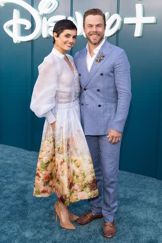 <p>Frank Micelotta/Disney via Getty</p> Hayley Erbert and husband Derek Hough pose together for the launch of Hulu on Disney+