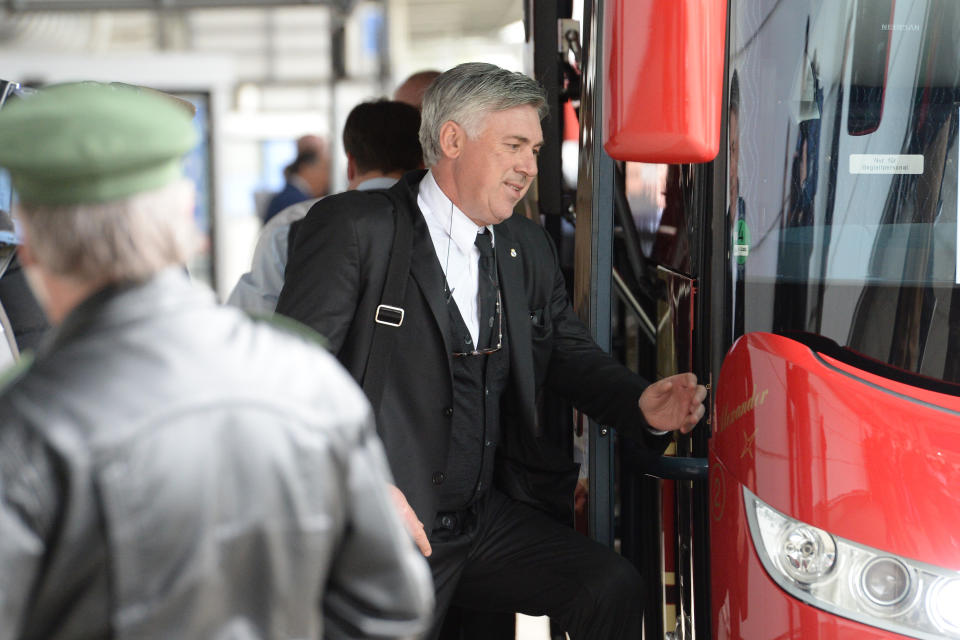 Real Madrid head coach Carlos Ancelotti arrives at the airport in Munich, Germany, oMonday, April 28, 2014. Bayern Munich will face Real Madrid in a second leg semifinal Champions League soccer match on Tuesday. (AP Photo/Kerstin Joensson)