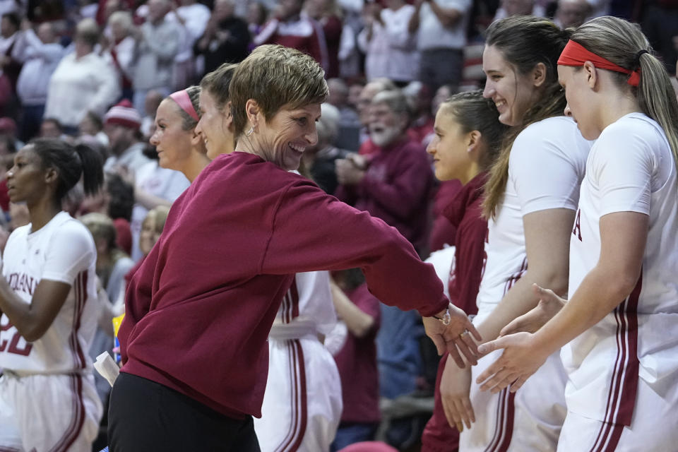 Indiana coach Teri Moren celebrates with players after Indiana defeated North Carolina 87-63 in an NCAA college basketball game Thursday, Dec. 1, 2022, in Bloomington, Ind. (AP Photo/Darron Cummings)