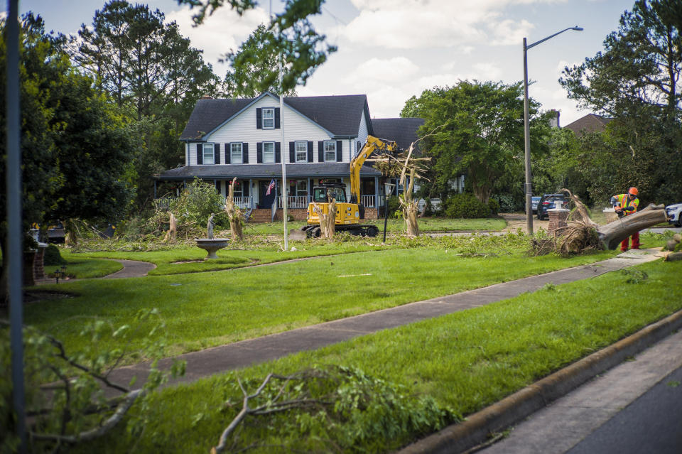 Image: Damage from Sunday's EF-3 rated tornado is cleaned up in the Great Neck area of Virginia Beach, Va., on May 1, 2023. (John C. Clark / AP)