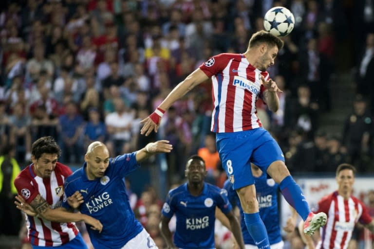 Atletico Madrid's midfielder Saul Niguez goes up for a header during the UEFA Champions League quarter final first leg football match against Leicester City April 12, 2017