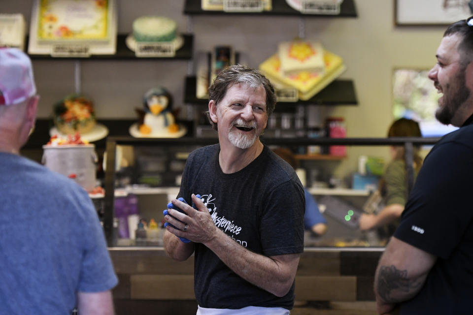 Baker Jack Phillips, owner of Masterpiece Cakeshop, accepts congratulations and thanks in his Colorado shop after the U.S. Supreme Court voted 7-2 in his favor. (Photo: Joe Amon via Getty Images)