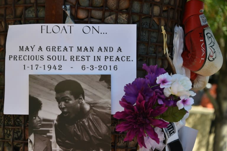 Items left by people paying homage to boxing legend Muhammad Ali on June 4, 2016 in front of the hospital in Scottsdale, Arizona where he died