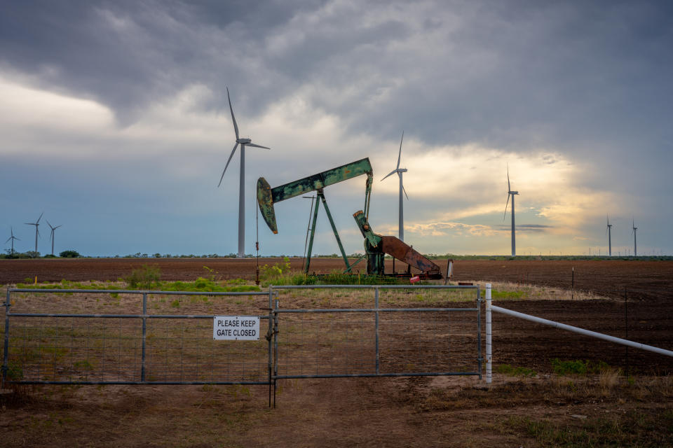 NOLAN, TEXAS - OCTOBER 04: An oil pumpjack is seen near a field of wind turbines on October 04, 2023 in Nolan, Texas. The U.S. oil industry is headed towards a record-breaking year as analysts expect the crude market to continue climbing despite minor slowing. (Photo by Brandon Bell/Getty Images)