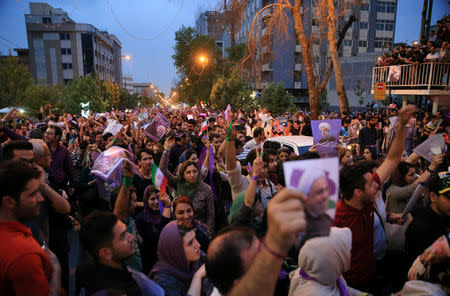 Supporters of Iranian president Hassan Rouhani gather as they celebrate his victory in the presidential election in Tehran, Iran, May 20, 2017. TIMA via REUTERS