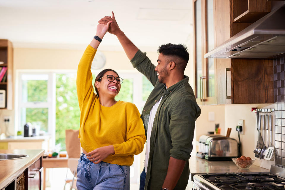 A couple dancing in the kitchen