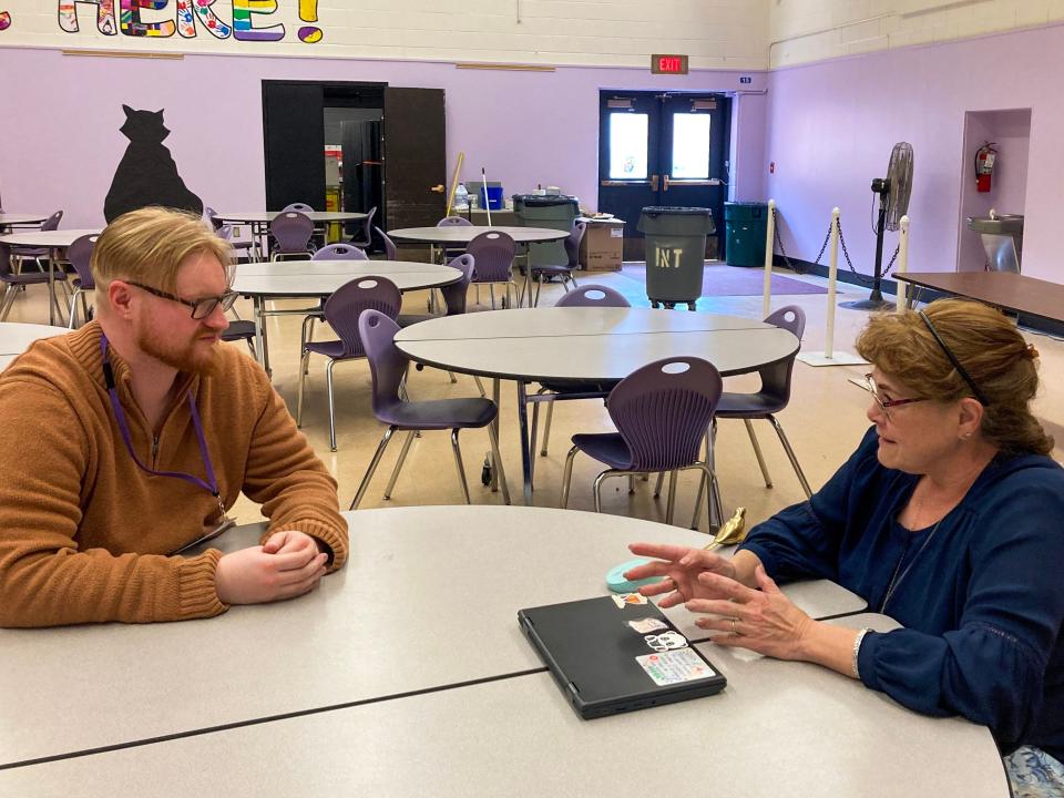 Daniel Bennett, left, meets with colleague Jennifer Gibson, a longtime special education teacher, at Sodus Intermediate School in upstate New York. Bennett was a school psychology intern in a region that has sometimes struggled to staff roles like his.