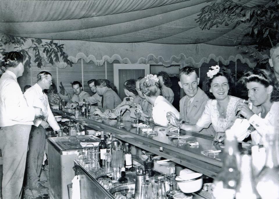 World War II servicemen and their dates enjoy the bar at Ta-boo.