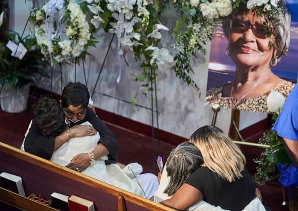 PHOTO: Angela Crawley and Robin Harris, daughters of shooting victim Ruth Whitfield, greet mourners during the funeral service in Buffalo, New York, May 28, 2022. (Geoff Robins/AFP via Getty Images, FILE)
