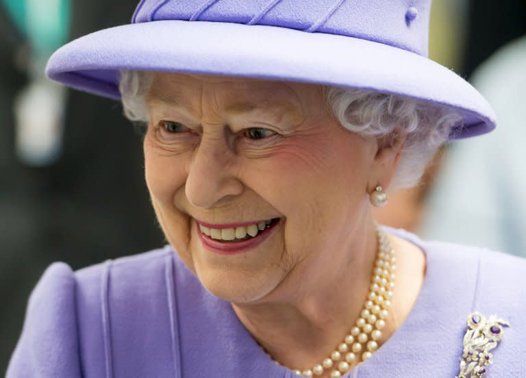 Britain's Queen Elizabeth II meets with staff during a tour of the new Royal London Hospital building in London on February 27, 2013. Queen Elizabeth II will miss the Commonwealth heads of government meeting in Sri Lanka in November, sending her son Prince Charles in her place, the palace announced on Tuesday