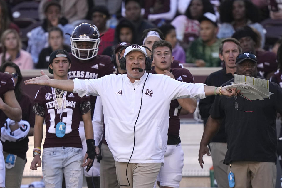 FILE - Texas A&M coach Jimbo Fisher yells to the officials during the first half of an NCAA college football game against Auburn Saturday, Nov. 6, 2021, in College Station, Texas. exas A&M coach Jimbo Fisher called Nick Saban a “narcissist” Thursday, May 19, 2022, after the Alabama coach made “despicable” comments about the Aggies using name, image and likeness deals to land their top-ranked recruiting classes. Saban called out Texas A&M on Wednesday night for “buying” players. (AP Photo/David J. Phillip, File)