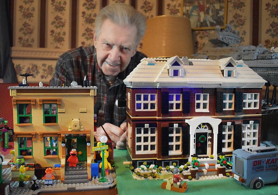Bob Higgins with his Lego builds of Sesame Street and the Home Alone house.