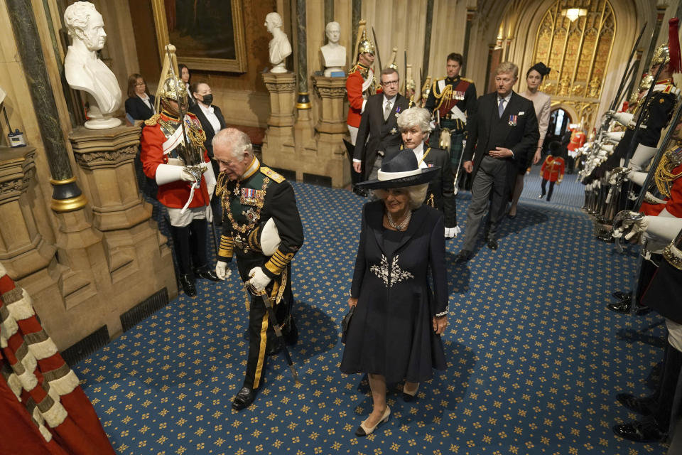 Britain's Prince Charles, left, and Camilla, Duchess of Cornwall, arrive for the State Opening of Parliament in the House of Lords at the Palace of Westminster, in London, Tuesday, May 10, 2022. Britain’s Parliament is opening a new year-long session with Prime Minister Boris Johnson trying to re-energize his scandal-tarnished administration and address the U.K.’s worsening cost-of-living crisis. (Aaron Chown/Pool Photo via AP)