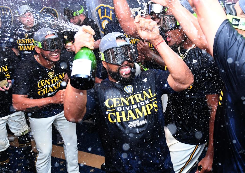 The Milwaukee Brewers celebrate after securing the NL Central title.