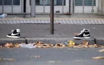 A pair of abandoned shoes seen left in the street near the Bataclan concert hall the morning after a series of deadly attacks in Paris, November 14, 2015. REUTERS/Charles Platiau