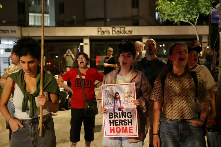 Demonstrators carry a poster of Hersh Goldberg-Polin at a rally in Jerusalem urging action to rescue hostages remaining in Gaza (AHMAD GHARABLI)