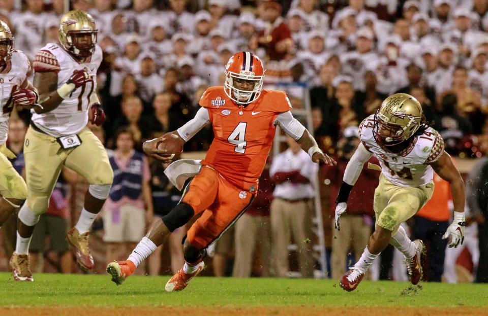 Clemson quarterback Deshaun Watson (4) runs near Florida State's Derrick Mitchell Jr.(left) and Javien Elliott during the 4th quarter at Memorial Stadium in Clemson in 2015.