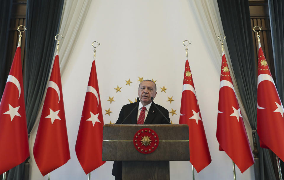 Turkey's President Recep Tayyip Erdogan speaks to a group of US businessmen at his palace, in Ankara, Turkey, Tuesday, Sept. 10, 2019. Turkey accused the United States on Tuesday of taking only "cosmetic steps" toward the creation of a so-called "safe zone" in northeast Syria and renewed Ankara's threat of unilateral military intervention to form a buffer area along its border.(Presidential Press Service via AP, Pool)