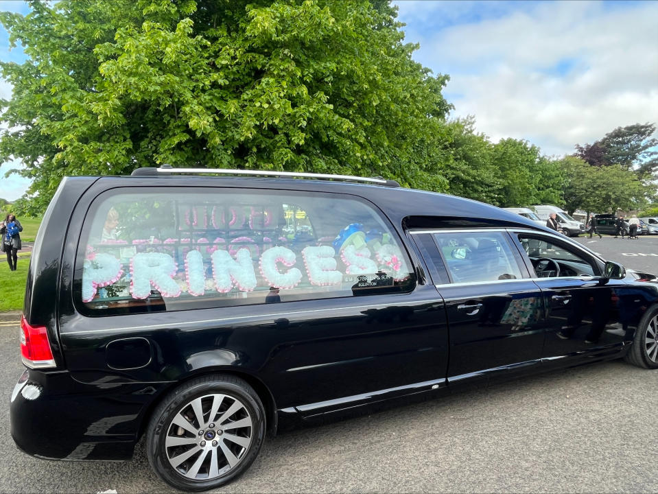 The funeral car for Rebecca Browne outside St Joseph's church, Galliagh Co. Londonderry. Ms Browne died aged 21 after being hit by a Garda car in Co. Donegal. (Claudia Savage/PA)