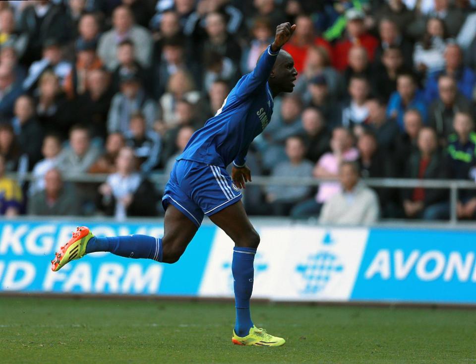 Chelsea's Demba Ba celebrates after scoring his team's opening goal during their English Premier League soccer match against Swansea City at the Liberty Stadium, Swansea, Wales, Sunday, April 13, 2014. (AP Photo/David Davies, PA Wire) UNITED KINGDOM OUT - NO SALES - NO ARCHIVES