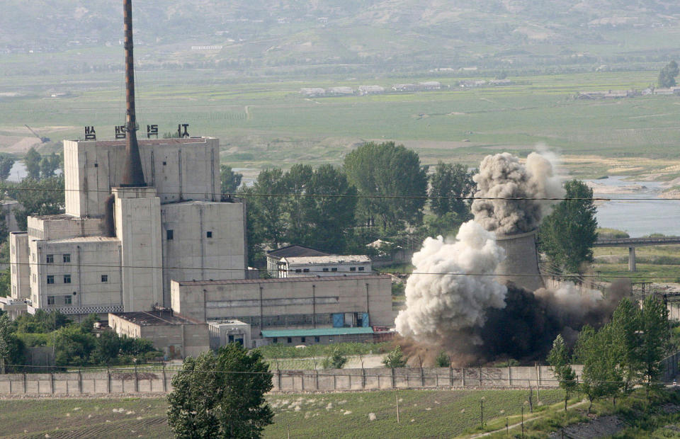 FILE - In this June 27, 2008, file photo released by China's Xinhua News Agency, the cooling tower of the Yongbyon nuclear complex is demolished in Yongbyon, North Korea. North Korea appears to have restarted the operation of its main nuclear reactor used to produce weapons fuels, the U.N. atomic agency said, as the North openly threatens to enlarge its nuclear arsenal amid long-dormant nuclear diplomacy with the United States. (Gao Haorong/Xinhua via AP, File)
