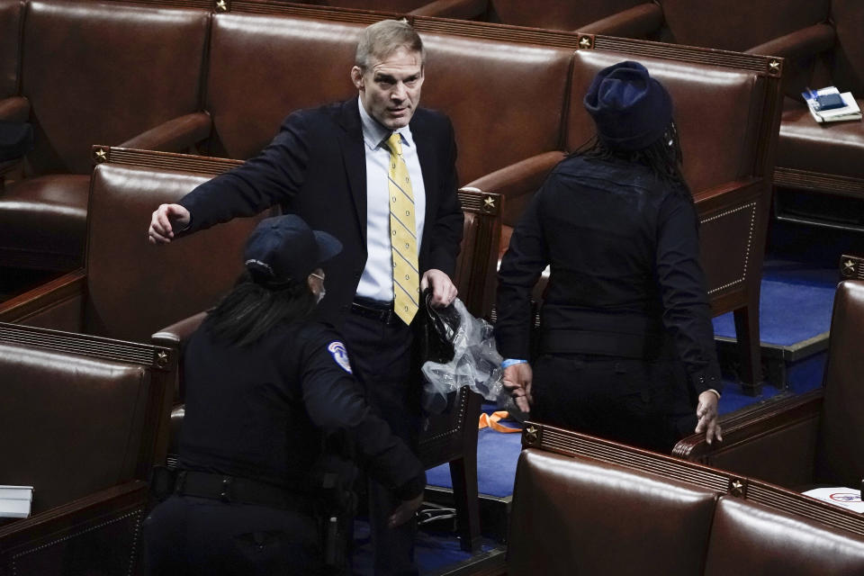 Rep. Jim Jordan, R-Ohio, prepares to evacuate the floor as protesters try to break into the House Chamber at the U.S. Capitol on Wednesday, Jan. 6, 2021, in Washington. (AP Photo/J. Scott Applewhite)