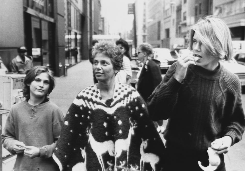 River Phoenix with his younger brother Joaquin Phoenix and mother Arlyn Phoenix, walking down 58th Street. (Photo By: John Roca/NY Daily News via Getty Images)