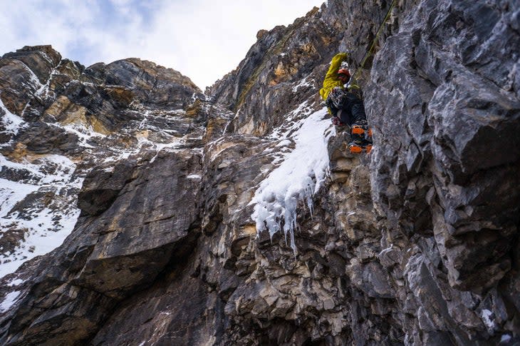 <span class="article__caption">With the right attitude you can jump on unknown terrain and give it your best shot; Jay Mills tacks his way onto overhanging dribbles on a face that has since seen its first ascent by the late great Marc-Andre Leclerc and Luka Lindic.</span> (Photo: Ian Welsted)