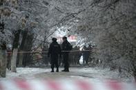 Police stand guard at the site of a blast on a trolleybus in Volgograd December 30, 2013. Russian President Vladimir Putin on Monday ordered law enforcement agencies to increase security in the southern city of Volgograd and nationwide after two deadly bombings in Volgograd, the Kremlin said. REUTERS/Sergei Karpov (RUSSIA - Tags: CIVIL UNREST CRIME LAW DISASTER TRANSPORT TPX IMAGES OF THE DAY)