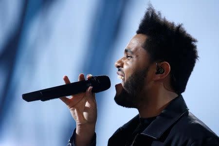 Musician The Weeknd performs during the 2016 Victoria's Secret Fashion Show at the Grand Palais in Paris, France, November 30, 2016. REUTERS/Charles Platiau/File Photo