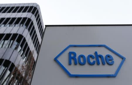 The logo of Swiss pharmaceutical company Roche is seen outside their headquarters in Basel January 30, 2014. REUTERS/Ruben Sprich