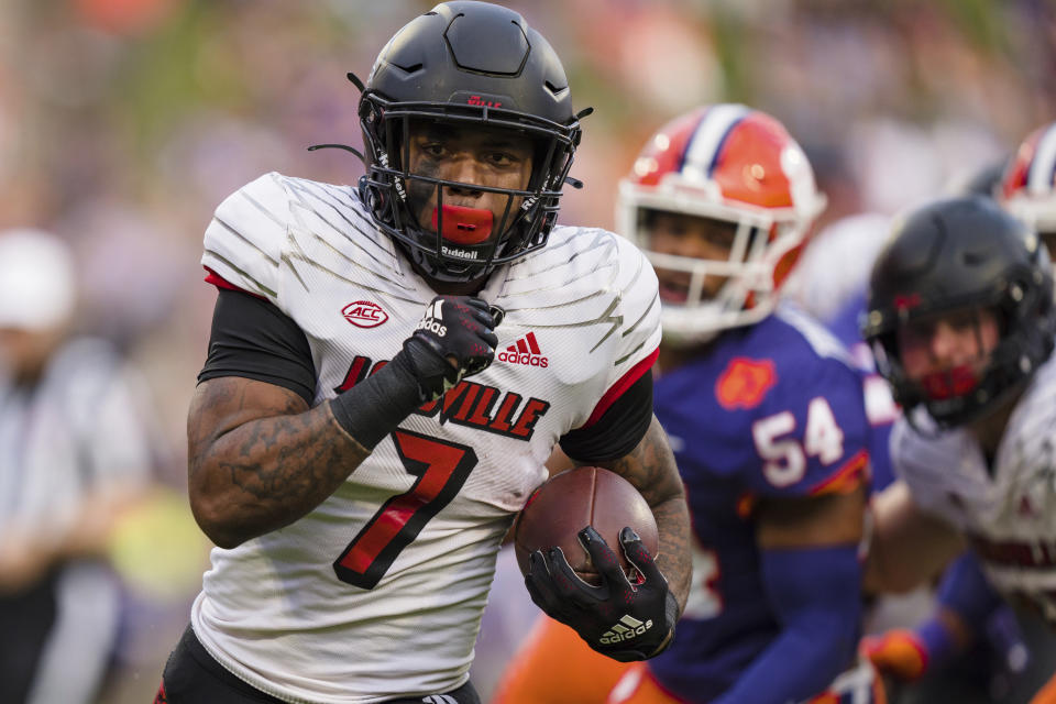 Louisville running back Tiyon Evans (7) runs with the ball for a touchdown in the first half of an NCAA college football game against Clemson, Saturday, Nov. 12, 2022, in Clemson, S.C. (AP Photo/Jacob Kupferman)