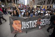 People march for the one year anniversary of George Floyd's death on Sunday, May 23, 2021, in Minneapolis, Minn. (AP Photo/Christian Monterrosa)