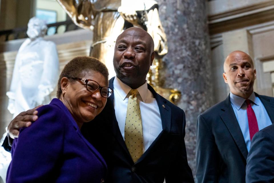 Rep. Karen Bass, D-Calif., Sen. Tim Scott, R-S.C., and Sen. Cory Booker, D-N.J., depart the office of Rep. James Clyburn, D-S.C., following a meeting about police reform legislation on Capitol Hill in 2021.