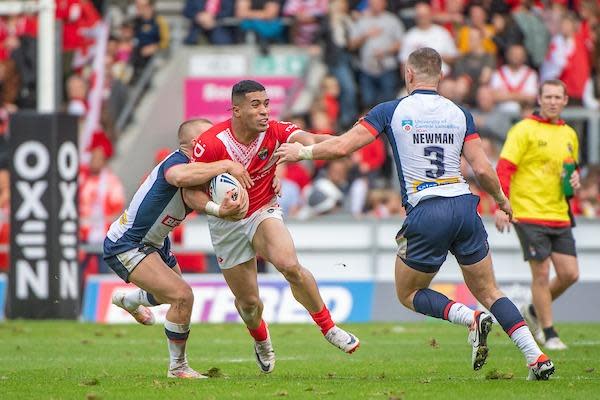 England's Leeds Rhinos centre Harry Newman moves in to tackle Tolutau Koula of Tonga. Picture by Olly Hassell/SWpix.com.