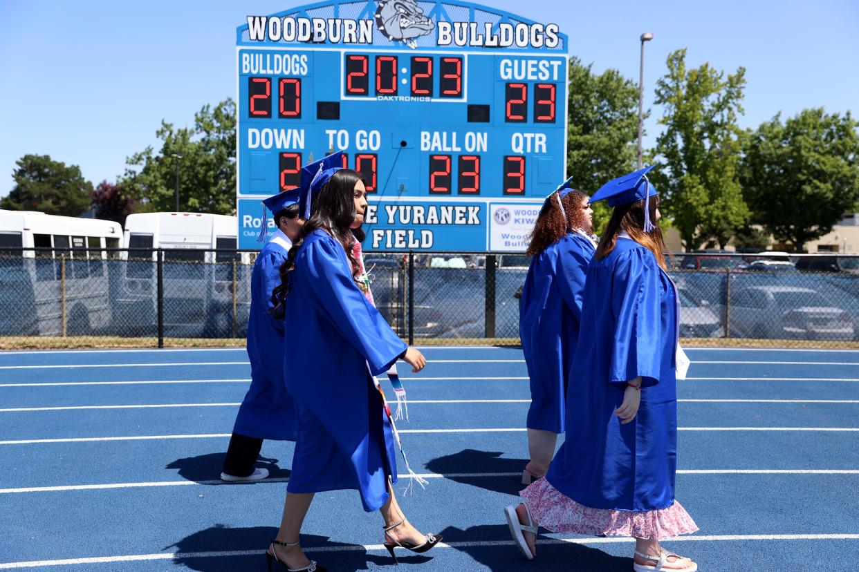 Graduates walk to their seats during the Woodburn High School graduation ceremony June 10.