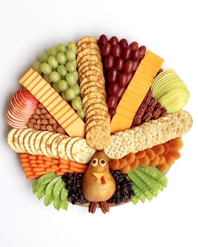 <p>The Baker Mama</p><p>Here's how to make a festive and delicious turkey snack board for everyone to gobble up at your Thanksgiving gatherings!</p><p><strong>Get the recipe: <a href="https://thebakermama.com/recipes/turkey-snack-board/" rel="nofollow noopener" target="_blank" data-ylk="slk:Turkey Snack Board;elm:context_link;itc:0;sec:content-canvas" class="link ">Turkey Snack Board</a></strong></p>
