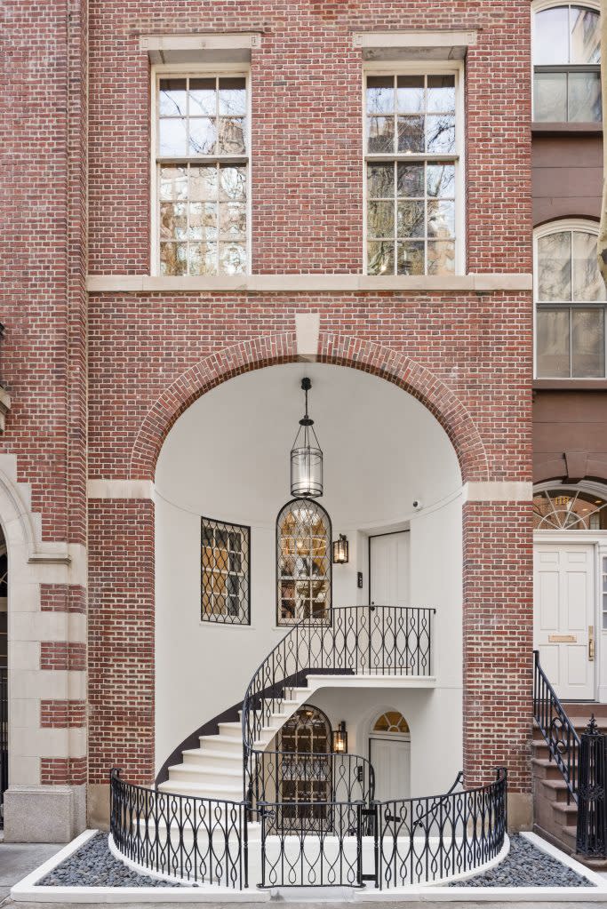 the neo-Georgian home boasts brick and limestone accents. Russ Ross Photography, Inc.