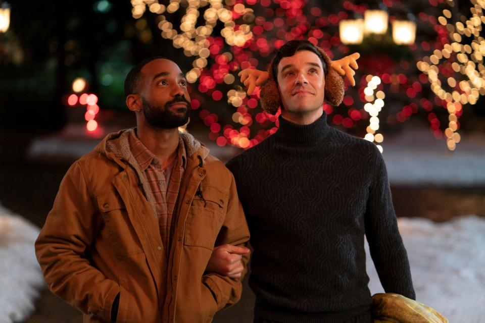 Peter (Michael Urie, right) takes best friend Nick (Philemon Chambers) home for Christmas in the Netflix holiday romantic comedy "Single All the Way."