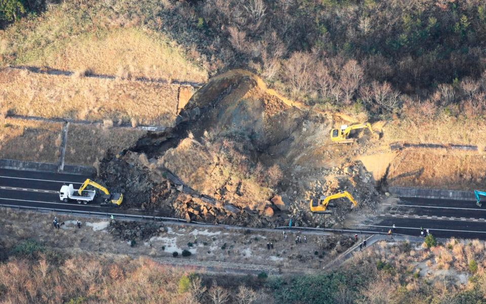 A portion of a highway is blocked by a landslide  -  Kyodo News