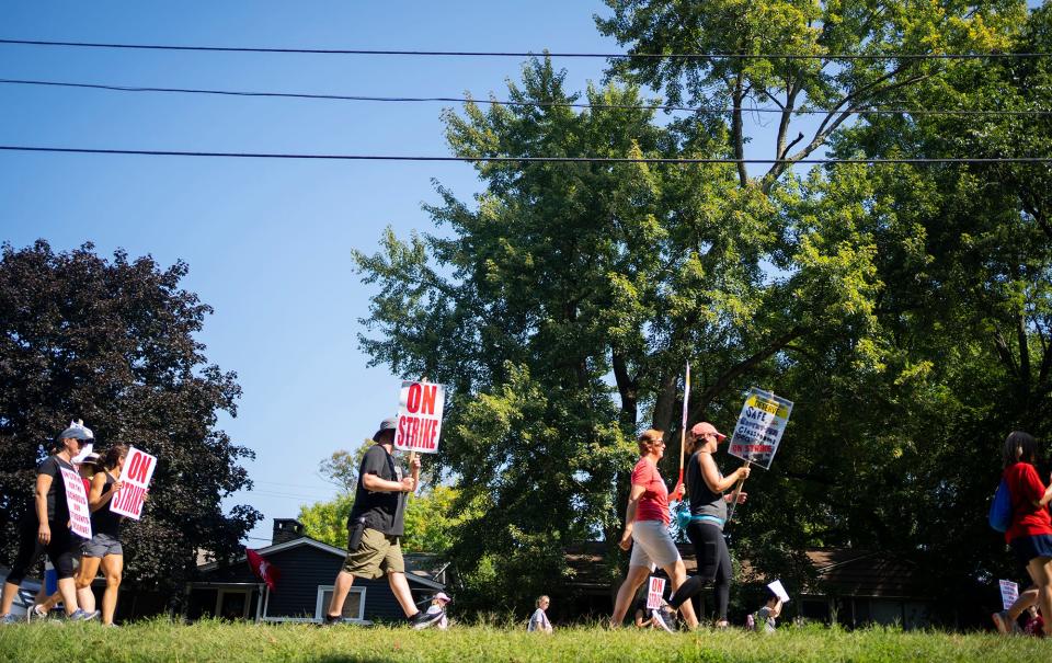 Aug 23, 2022; Columbus, Ohio, USA; Teachers and other CEA union members, and supporters march up and down Henderson Rd. outside of Whetstone High School on day two of the strike. 