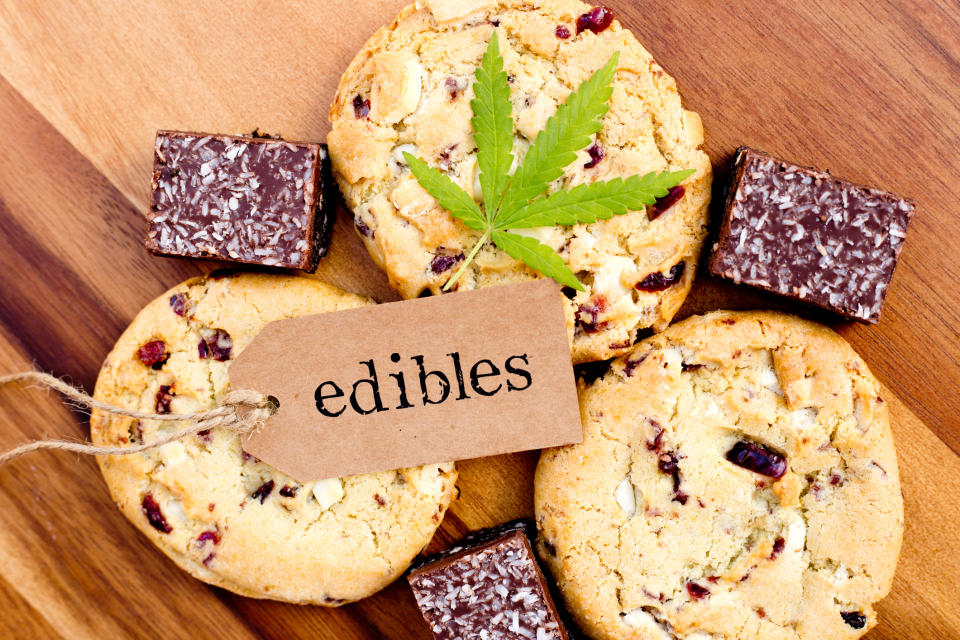 A label that says edibles and a single cannabis leaf lying atop cookies and brownies.